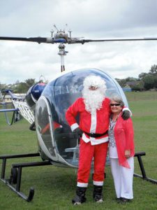 Santa delivering presents by helicopter